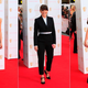 Image for article titled Lots of Red, Charming Crocs, & Strange Headgear at the TV BAFTA Awards
